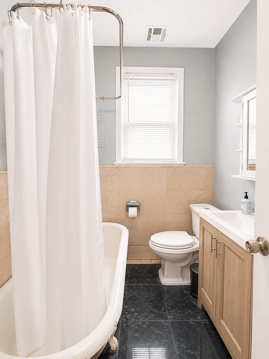 Full bathroom with bathtub, shower curtain, and vanity